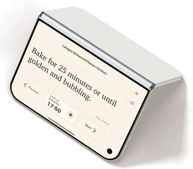 iPhone Duo stood like a tent, Cook View on its outer display: “Bake for 25 minutes or until golden and bubbling”, with Previous, the step’s timer running and Next.